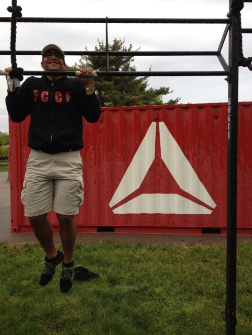 Doing a pull up at Reebok CrossFit